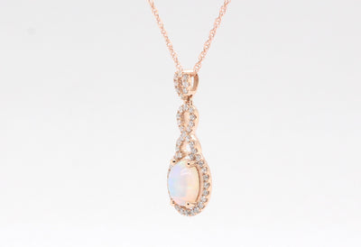 14KR .90 Ct Opal and Diamond Pendant