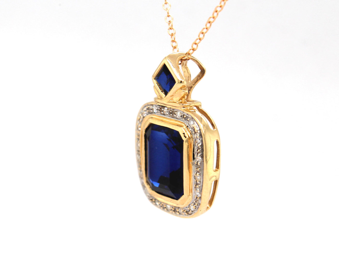 Estate 14KY 10.00 Cttw Created Sapphire and .10 Cttw Diamond Pendant