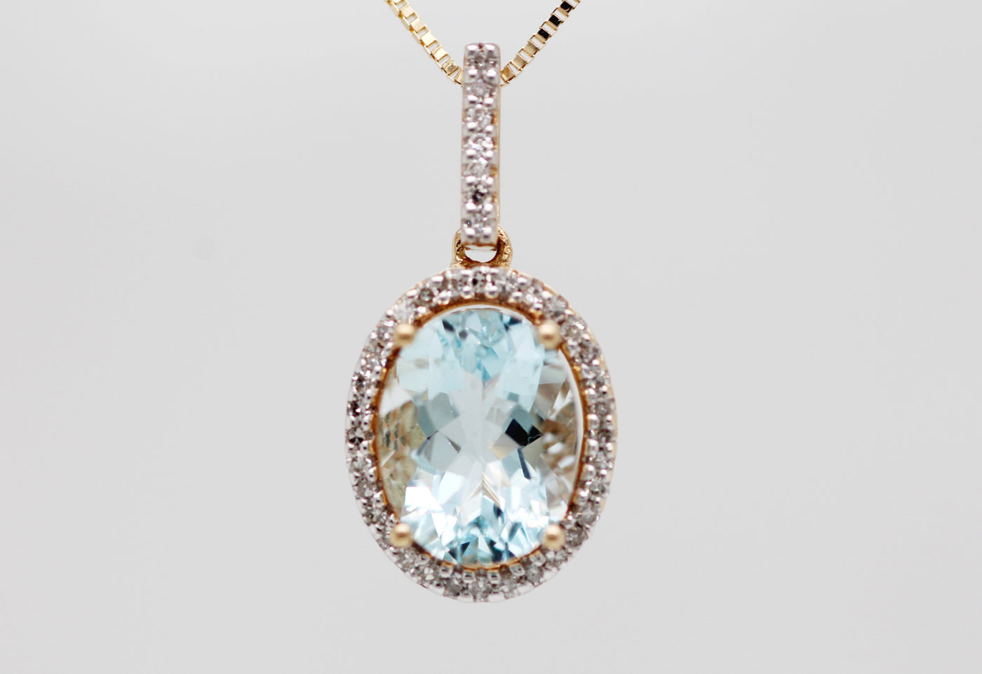 14KY 1.20 CT AQUAMARINE AND DIAMOND PENDANT .30 CTTW