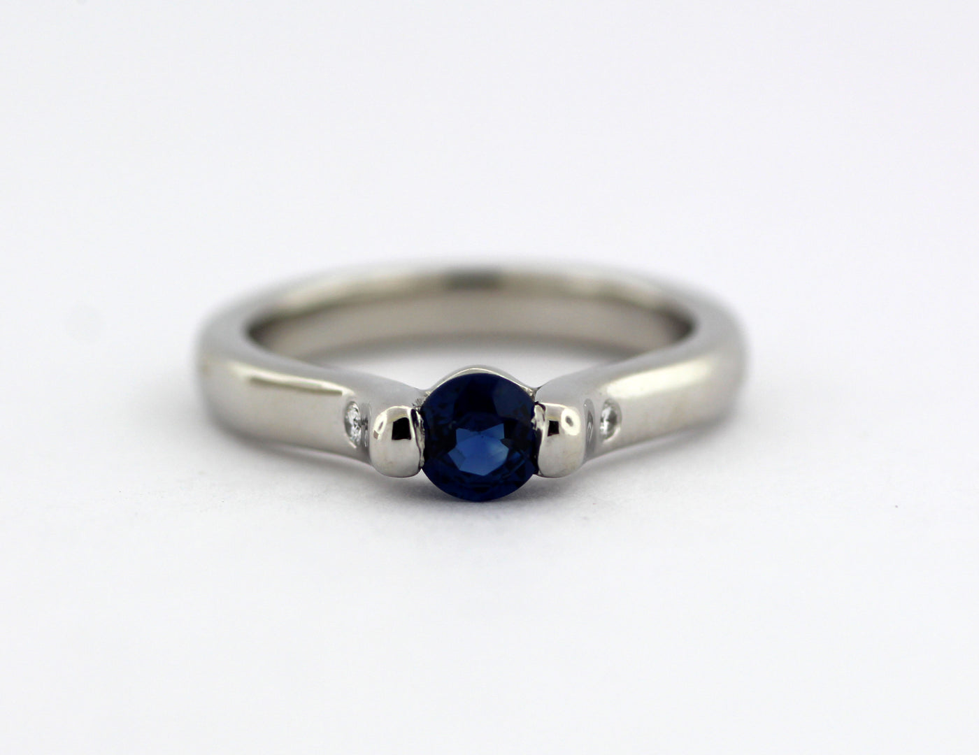 ESTATE PLATINUM .32 CT SAPPHIRE AND DIAMOND RING .02 CTTW