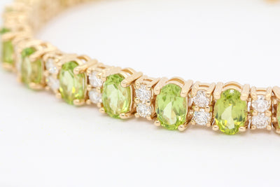 14KY 12.70 CTTW PERIDOT AND DIAMOND BRACELET, 2.30 CTTW