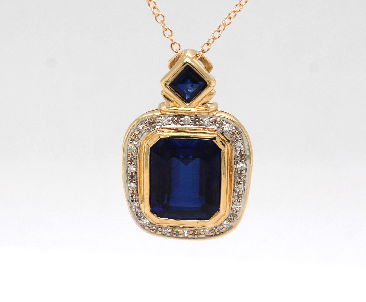 Estate 14KY 10.00 Cttw Created Sapphire and .10 Cttw Diamond Pendant