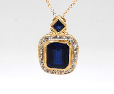 Estate 14KY 10.00 Cttw Created Sapphire and .10 Cttw Diamond Pendant