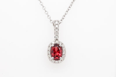 14KW .50 CT GARNET AND DIAMOND PENDANT, .14 CTTW H-SI1