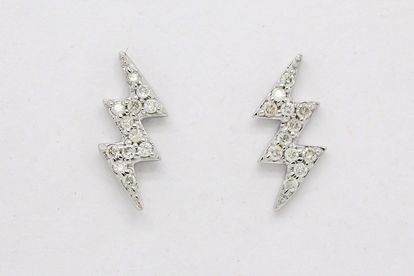14KW .09 Cttw diamond lightening bold stud earrings