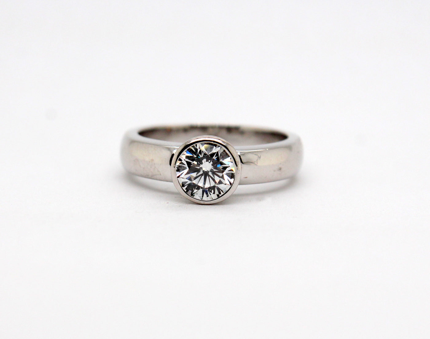 Platinum 1.01 Ct Round Brilliant Diamond Bezel Set Ring G in Color and