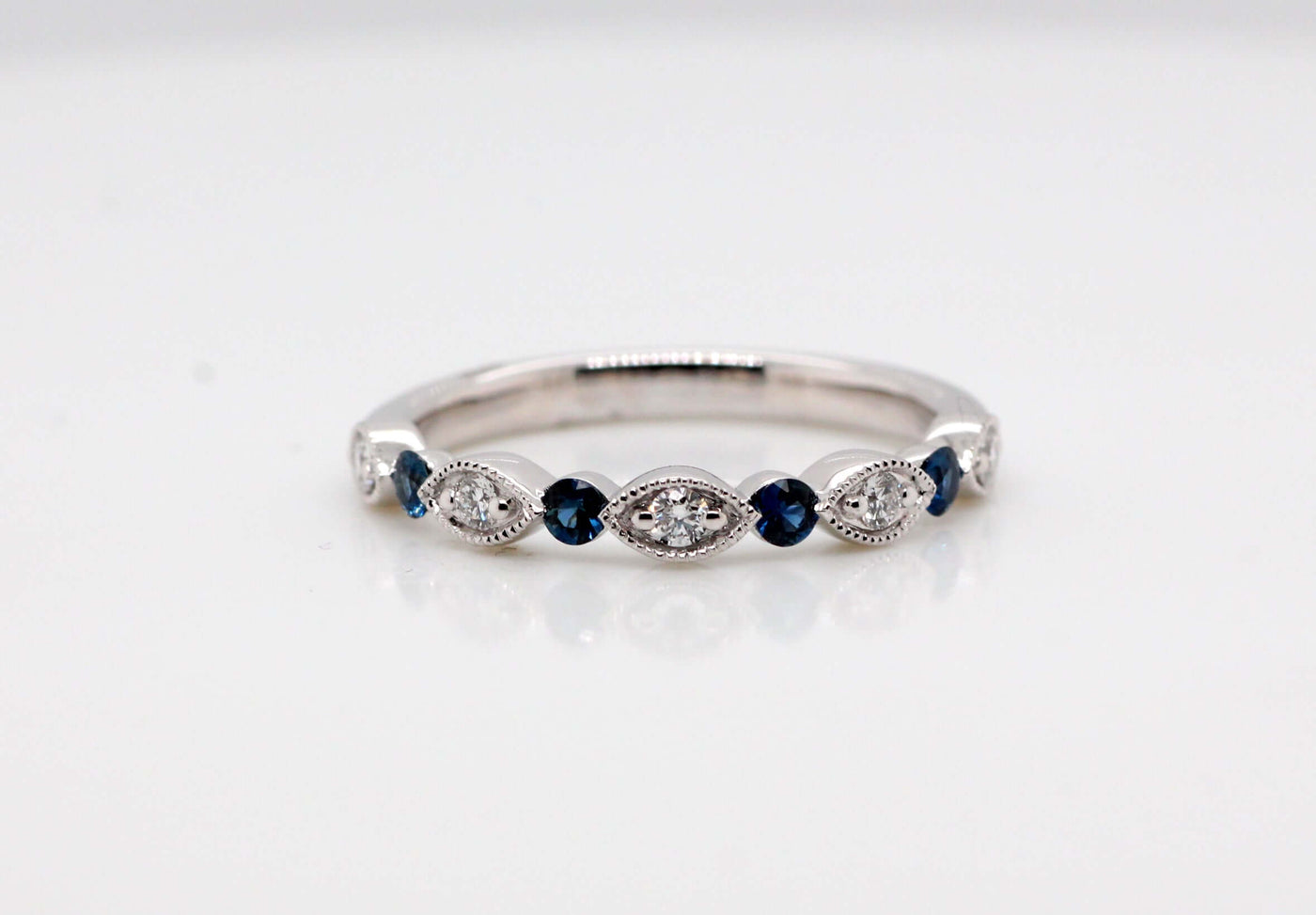 14KW .25 Ctw Sapphire and .13 Cttw Diamond wedding band G-SI2