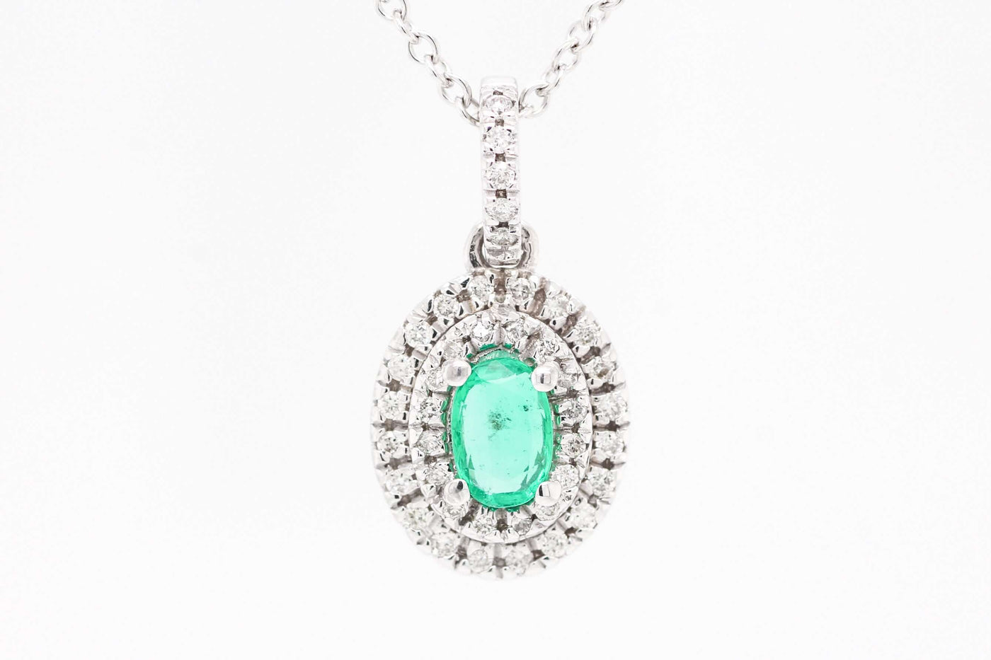 14KW .41 CT EMERALD AND DIAMOND PENDANT, .20 CTTW, H-SI2