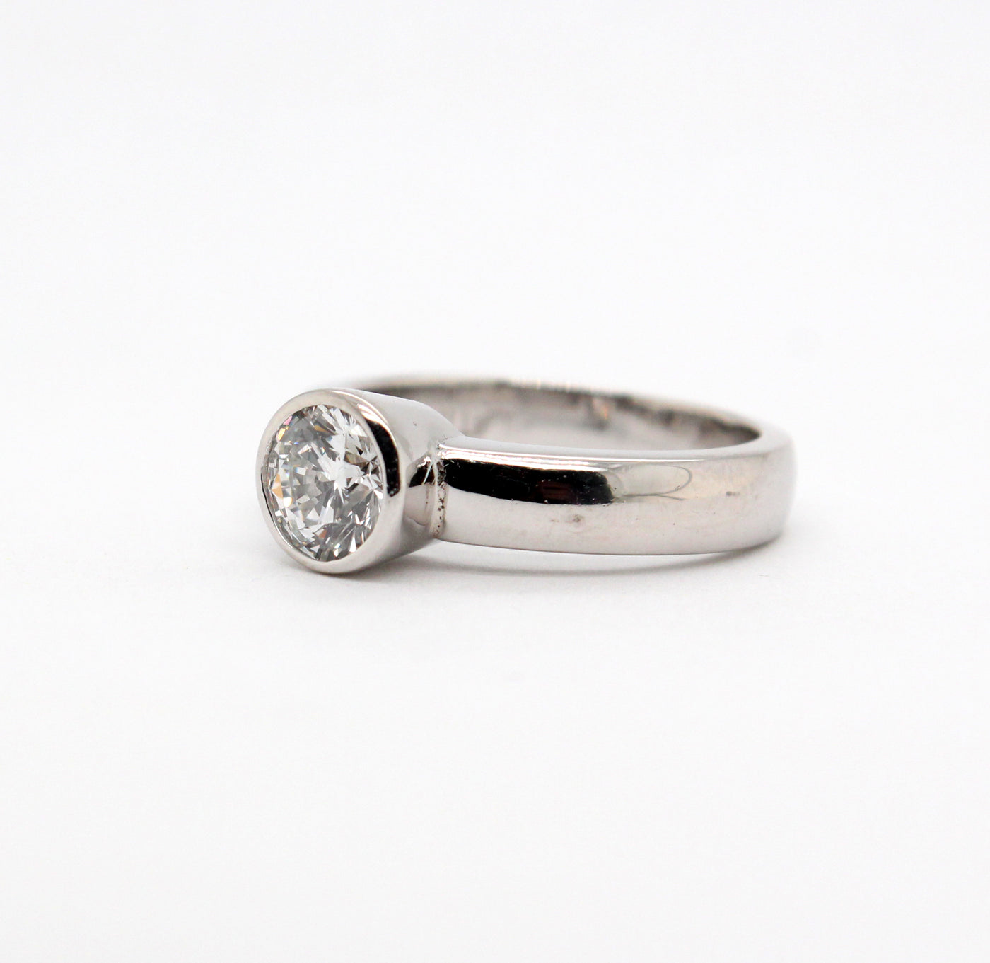 Platinum 1.01 Ct Round Brilliant Diamond Bezel Set Ring G in Color and