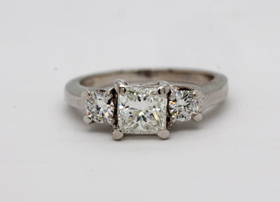 Platinum 3 stone ring with .90 Ct Princess cut Diamond, H in Color and