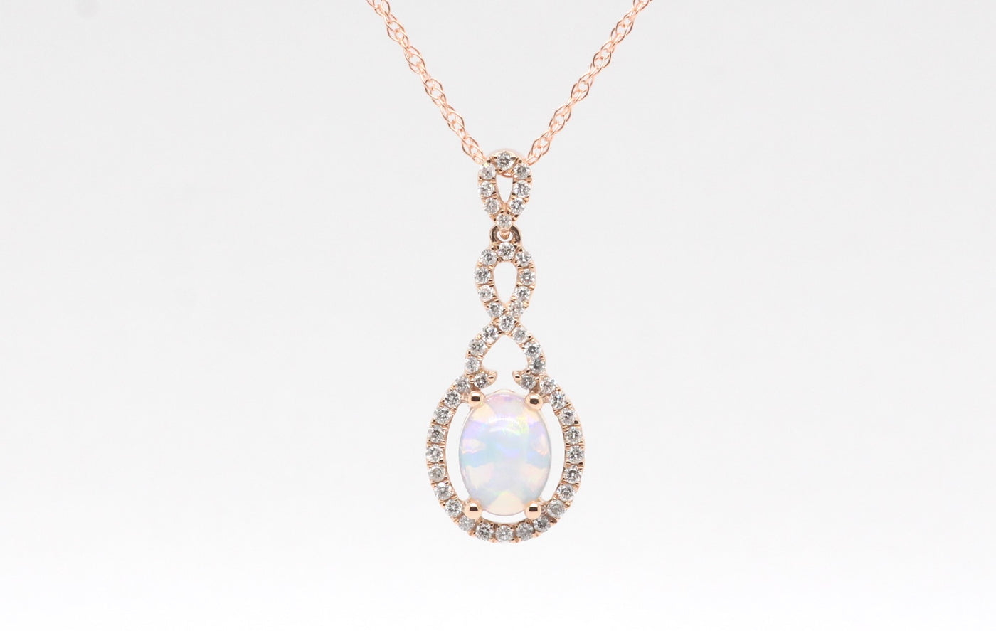 14KR .90 Ct Opal and Diamond Pendant