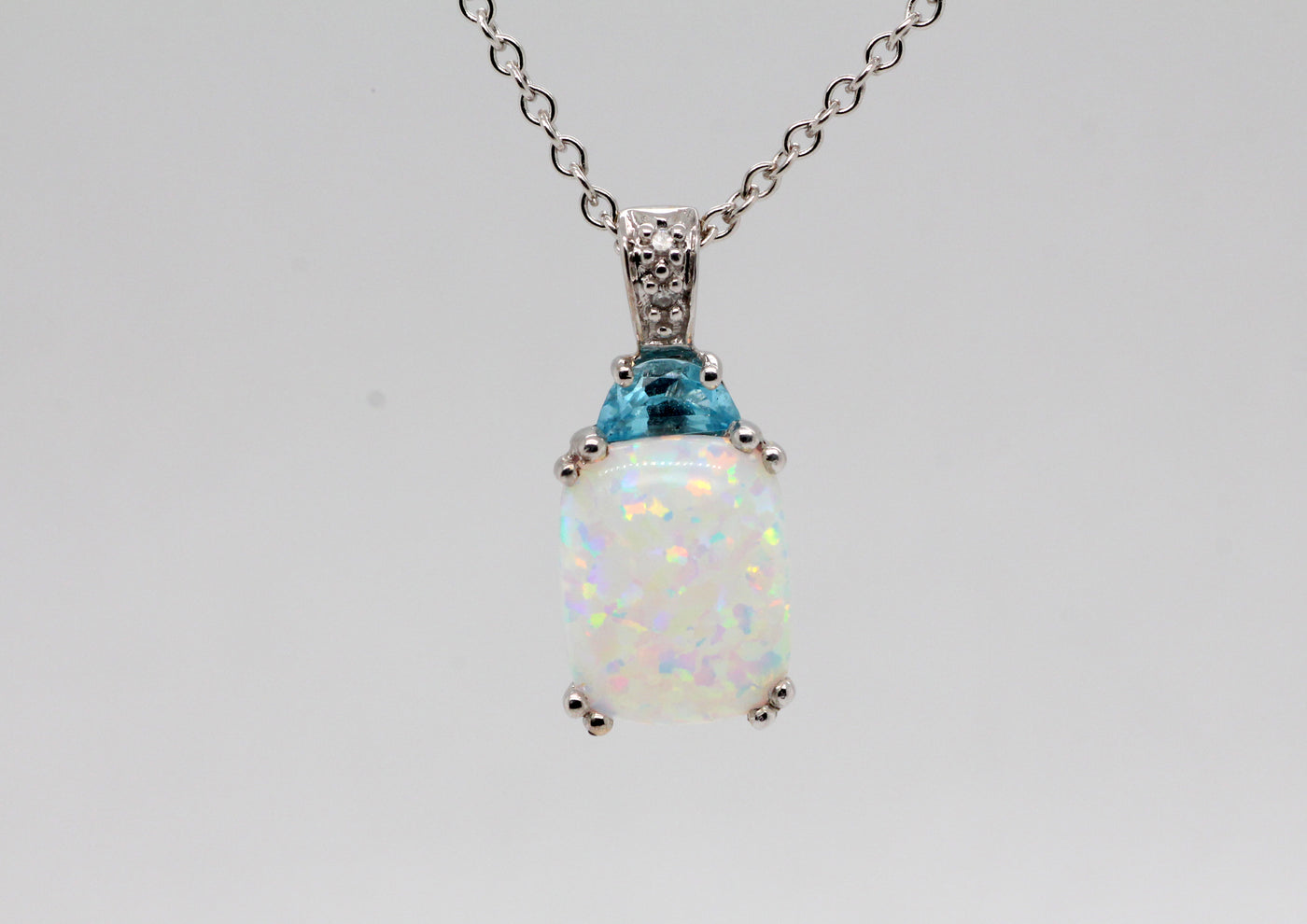 Estate 14KW 1.50 Ct Opal, .25 Ct Blue Topaz and .01 Ct Diamond Pendant