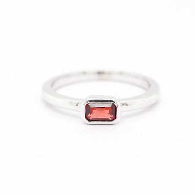 14KW .43 CT EMERALD CUT GARNET RING