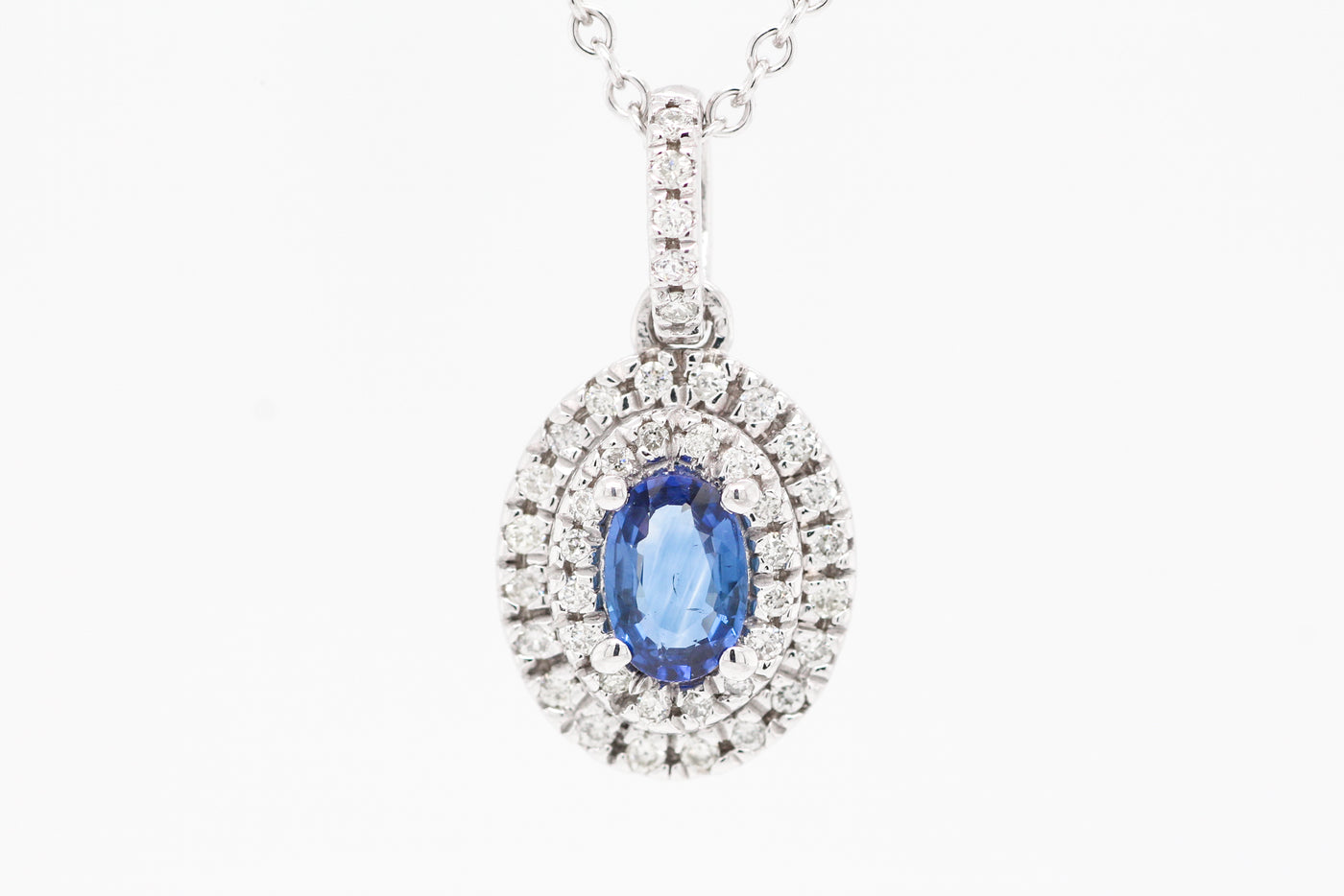14KW .48 CT SAPPHIRE AND DIAMOND PENDANT, .20 CTTW, H-SI2