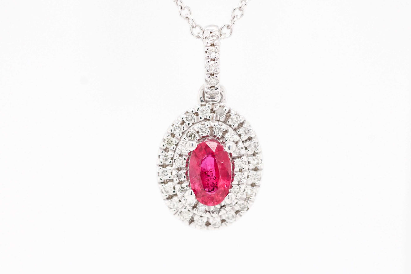 14KW .64 CT RUBY AND DIAMOND PENDANT, .20 CTTW, H-SI2