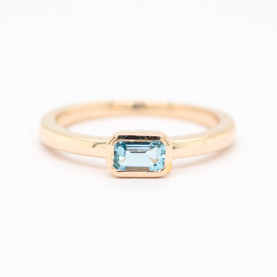 14KY .26 CT EMERALD CUT AQUAMARINE RING