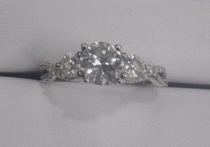 14KW 1.40 Cttw Diamond 3 Stone Style Engagement ring with .78 Ct Round