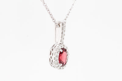 14KW .50 CT GARNET AND DIAMOND PENDANT, .14 CTTW H-SI1