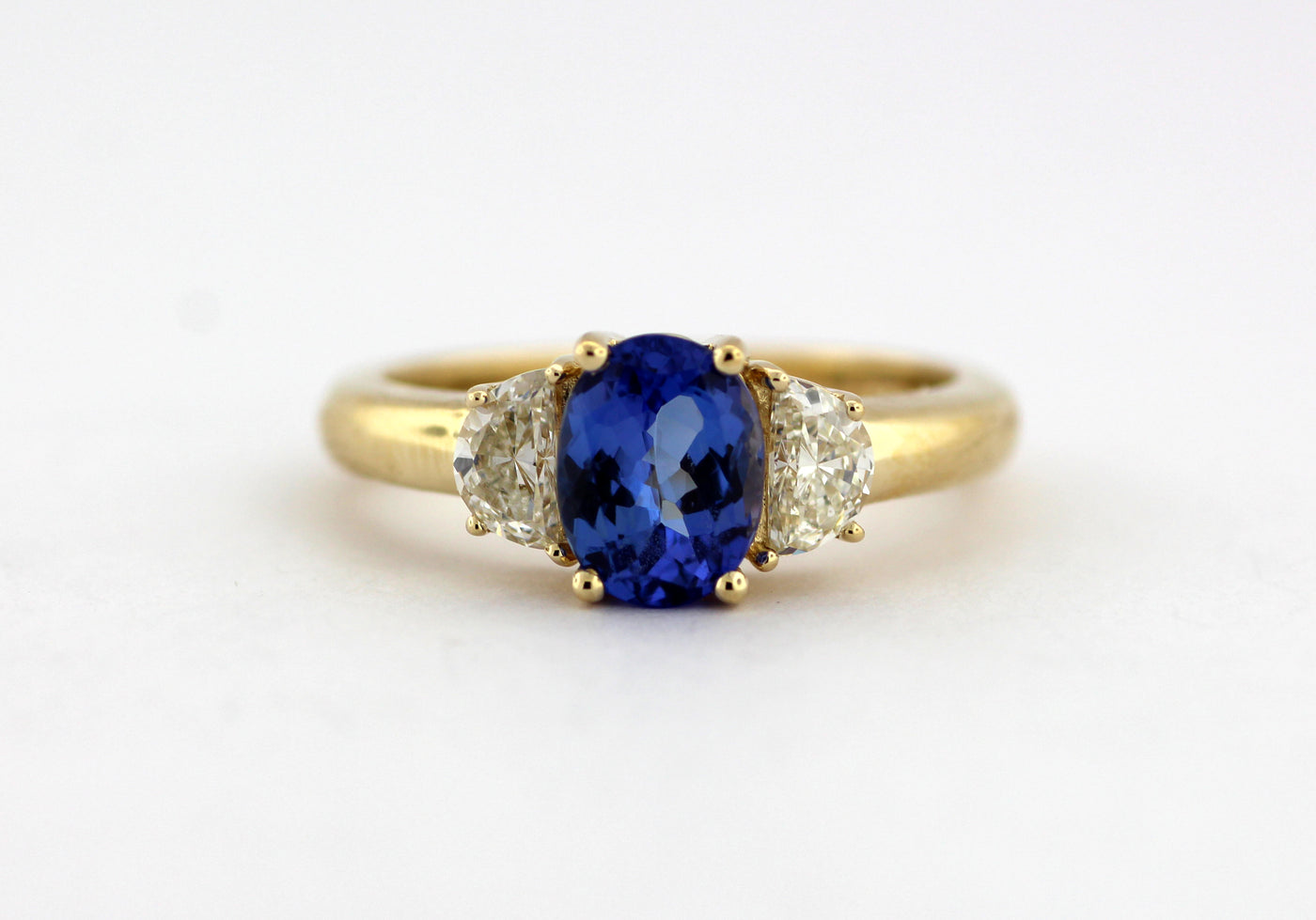 14KY 1.36 CT TANZANITE AND DIAMOND 3 STONE RING .48 CTTW H-J VS2-SI1