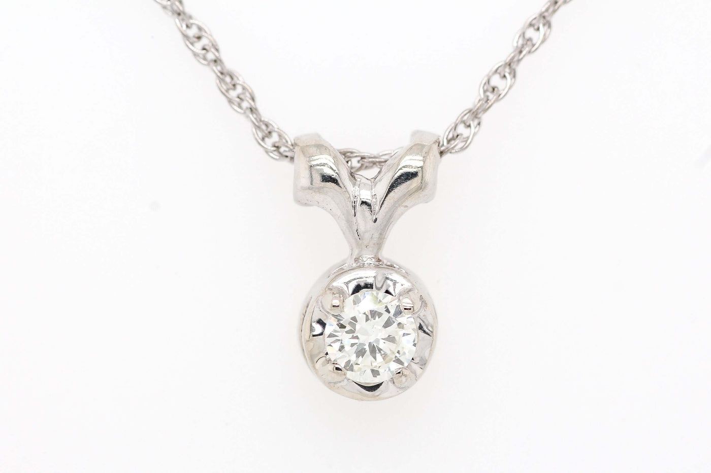 14kw .21 ct diamond solitaire pendant, i-si1