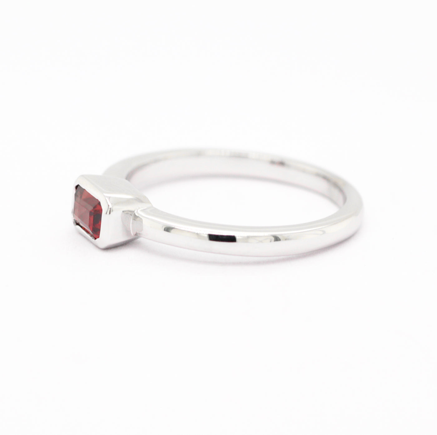 14KW .43 CT EMERALD CUT GARNET RING