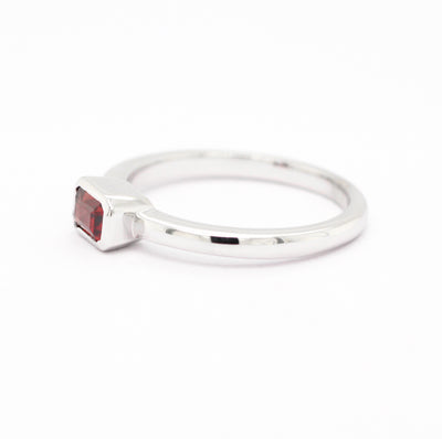 14KW .43 CT EMERALD CUT GARNET RING