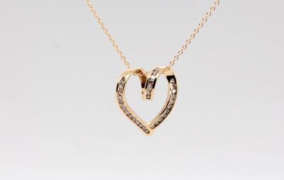 Estate 14KY .25 Cttw Diamond Heart Pendant