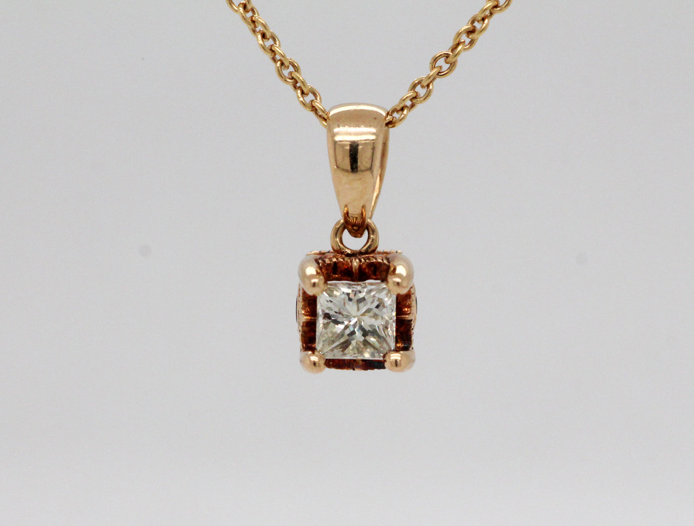 Estate 10KY .28 Ct Princess Cut Diamond and .04 Cttw Ruby Pendant