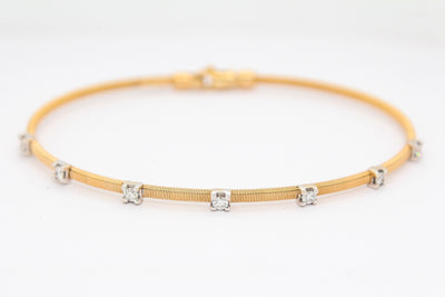 18KTT .25 CTTW DIAMOND BANGLE BRACELET