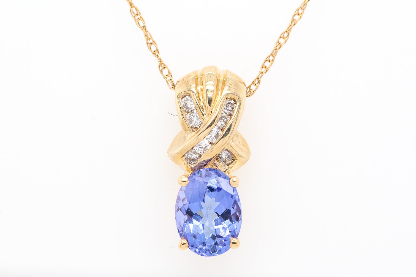 14KY 1.50 CT TANZANITE AND DIAMOND PENDANT .10 CTTW HJ-SI2
