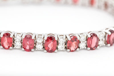 14KW 16.50 CTTW GARNET AND DIAMOND BRACELET, 2.85 CTTW GH-SI2