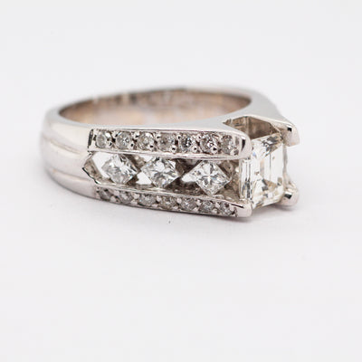 18KW 1CTTW DIAMOND ENGAGEMENT RING, .70CT EMER, CTR J-I1
N1445