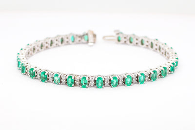 14KW 5.92 CTTW EMERALD AND DIAMOND BRACELET, 1.42 CTTW GH-SI2